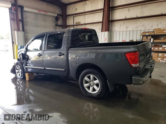 2012 Nissan Titan S with VIN 1N6AA0EC7CN311143, listed as a Copart auction lot 75181784 with 214,351 mi miles and Salvage Title. Bid and sale history available at carsss.com. Image 2.