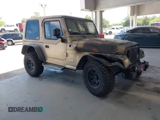 2003 Jeep Wrangler Sahara z VIN 1J4FA59S63P336928, wystawiony jako IAAI lot #42254314 z przebiegiem Nie podano mil oraz . Historia ofert i sprzedaży dostępna na DreamBid. Obrazek 1.