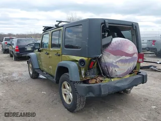 2008 Jeep Wrangler Unlimited X with VIN 1J4GA39158L529523, listed as a IAAI auction lot 41979992 with 304,641 mi miles. Bid and sale history available at carsss.com. Image 3.