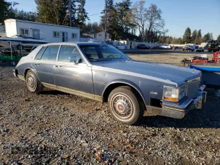 1984 Cadillac Seville z VIN 1G6AS6987EE810927, wystawiony jako Copart lot #42836105 z przebiegiem 19 894 mil mil oraz Tytuł czysty. Historia ofert i sprzedaży dostępna na DreamBid. Obrazek 4.