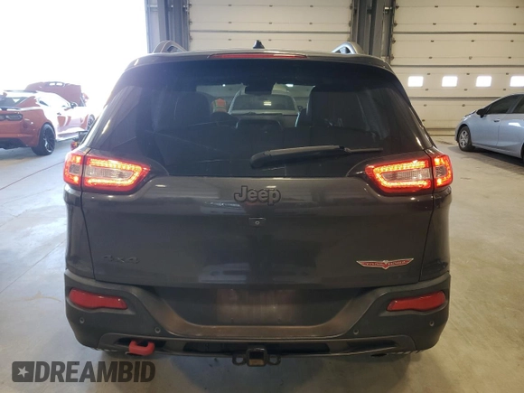 2015 Jeep Cherokee Trailhawk with VIN 1C4PJMBS5FW615845, listed as a Copart auction lot 52824635 with 134,873 mi miles and Salvage Title. Bid and sale history available at carsss.com. Image 6.