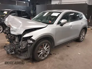 2021 Mazda CX-5 Grand Touring with VIN JM3KFBDM7M1392644, listed as a IAAI auction lot 41824612 with 80,000 mi miles and . Bid and sale history available at DreamBid. Image 2.