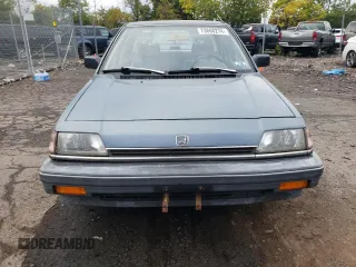 1987 Honda Civic z VIN 1HGEC4638HA016153, wystawiony jako Copart lot #73868274 z przebiegiem 22 876 mil mil oraz Tytuł czysty. Historia ofert i sprzedaży dostępna na DreamBid. Obrazek 5.