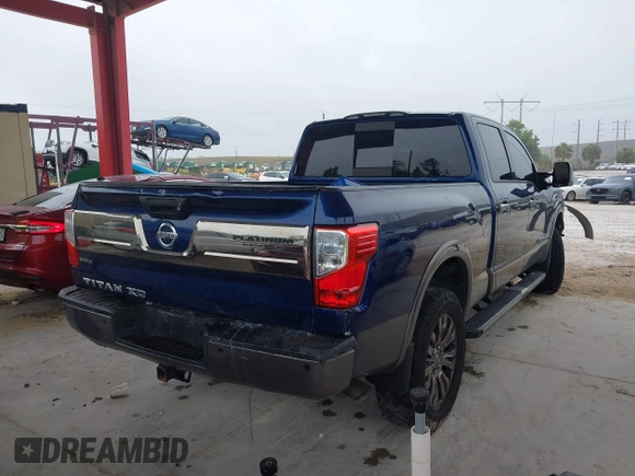 2016 Nissan Titan Platinum Reserve z VIN 1N6BA1F20GN509360, wystawiony jako IAAI lot #41921670 z przebiegiem 164 784 mil mil oraz . Historia ofert i sprzedaży dostępna na DreamBid. Obrazek 4.