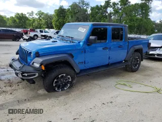 2023 Jeep Gladiator Sport S с VIN 1C6HJTAG4PL562366, выставлен на аукционе Copart как лот 51542765 с пробегом 21 564 миль миль и Списание • Salvage title. История ставок и продаж доступна на DreamBid. Изображение 1.