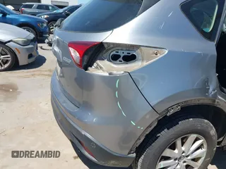 2014 Mazda CX-5 Sport with VIN JM3KE2BE7E0371203, listed as a IAAI auction lot 42243756 with 121,534 mi miles and . Bid and sale history available at DreamBid. Image 18.
