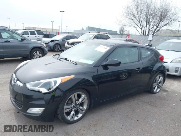 2013 Hyundai Veloster w/Black Int with VIN KMHTC6AD8DU155575, listed as a IAAI auction lot 41722849 with 100,204 mi miles and . Bid and sale history available at DreamBid. Image 2.
