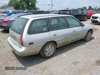 1997 Ford Escort LX z VIN 3FALP15PXVR164048, wystawiony jako IAAI lot #42401563 z przebiegiem 177 024 mil mil oraz . Historia ofert i sprzedaży dostępna na DreamBid. Obrazek 4.