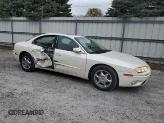 2001 Oldsmobile Aurora z VIN 1G3GS64CX14180971, wystawiony jako Copart lot #79035554 z przebiegiem 62 228 mil mil oraz Szkody całkowita. Historia ofert i sprzedaży dostępna na DreamBid. Obrazek 4.