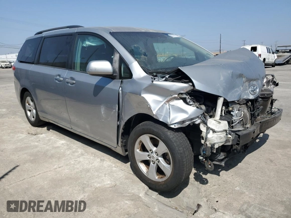 2012 Toyota Sienna LE AAS with VIN 5TDKK3DC2CS207404, listed as a Copart auction lot 62781215 with 200,757 mi miles and Salvage title. Bid and sale history available at DreamBid. Image 4.