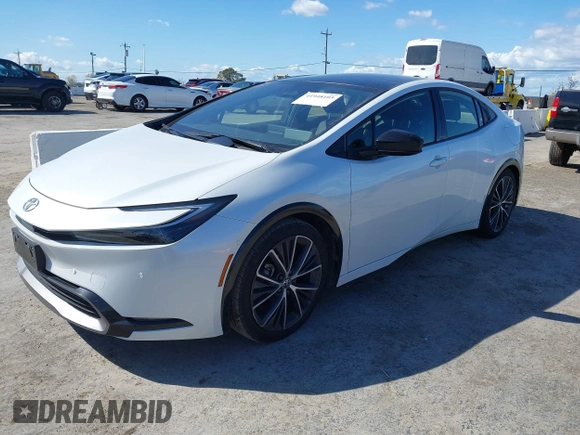 2023 Toyota Prius LE with VIN JTDACAAUXP3012538, listed as a IAAI auction lot 41948103 with 33,338 mi miles and . Bid and sale history available at DreamBid. Image 2.