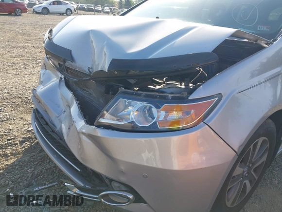2014 Honda Odyssey Touring with VIN 5FNRL5H95EB108427, listed as a IAAI auction lot 39992643 with 100,658 mi miles and . Bid and sale history available at DreamBid. Image 6.