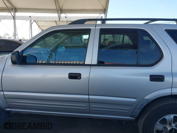 2001 Isuzu Rodeo S with VIN 4S2CK58W614361048, listed as a IAAI auction lot 41681566 with 133,460 mi miles and . Bid and sale history available at DreamBid. Image 14.