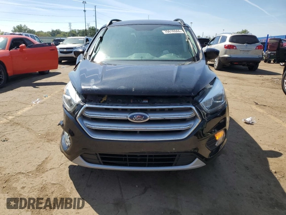 2017 Ford Escape SE z VIN 1FMCU0GD5HUD52467, wystawiony jako Copart lot #70616944 z przebiegiem 115 876 mil mil oraz Szkoda całkowita • Salvage title. Historia ofert i sprzedaży dostępna na DreamBid. Obrazek 5.