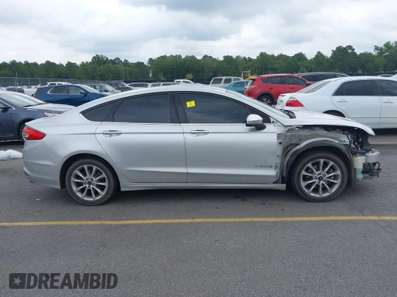 2017 Ford Fusion Hybrid SE with VIN 3FA6P0LU2HR317784, listed as a IAAI auction lot 42618554 with 114,814 mi miles and . Bid and sale history available at DreamBid. Image 14.