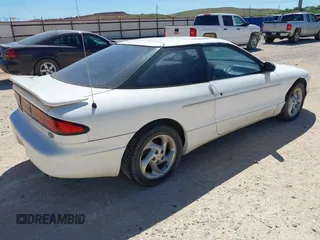 1996 Ford Probe z VIN 1ZVLT22B0T5127219, wystawiony jako IAAI lot #42279311 z przebiegiem 123 290 mil mil oraz . Historia ofert i sprzedaży dostępna na DreamBid. Obrazek 4.