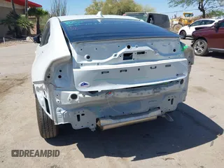 2024 Toyota Prius LE with VIN JTDACAAU5R3046244, listed as a IAAI auction lot 42464523 with 13,590 mi miles and . Bid and sale history available at DreamBid. Image 6.