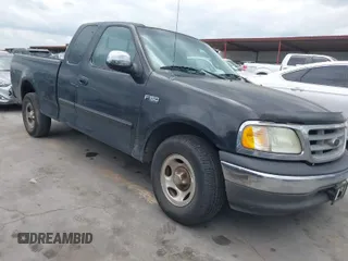 2002 Ford F-150 XL with VIN 1FTRX17202NA21470, listed as a IAAI auction lot 42098554 with 149,840 mi miles. Bid and sale history available at carsss.com. Image 1.