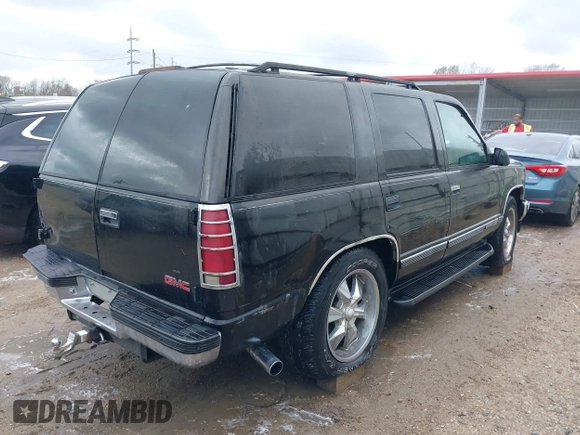 1998 GMC Yukon with VIN 1GKEC13R8WJ711255, listed as a IAAI auction lot 41457304 with 291,211 mi miles. Bid and sale history available at carsss.com. Image 4.