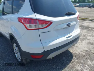 2014 Ford Escape SE with VIN 1FMCU9GX9EUC61521, listed as a IAAI auction lot 42535244 with 129,315 mi miles and . Bid and sale history available at DreamBid. Image 6.