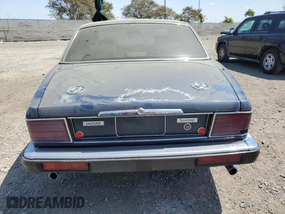 1992 Jaguar XJ with VIN SAJHY174XNC649368, listed as a Copart auction lot 50191454 with 99,553 mi miles and Salvage Title. Bid and sale history available at DreamBid. Image 6.