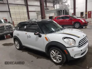2014 MINI Countryman with VIN WMWZB3C53EWM32528, listed as a IAAI auction lot 42283792 with 106,672 mi miles and . Bid and sale history available at DreamBid. Image 1.
