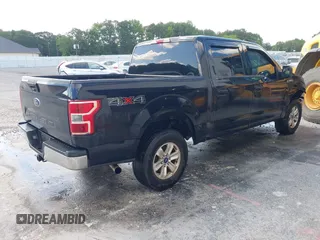 2019 Ford F-150 XL with VIN 1FTEW1E56KFA63764, listed as a IAAI auction lot 42410872 with 124,648 mi miles and . Bid and sale history available at DreamBid. Image 4.