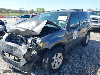 2006 Ford Escape XLT with VIN 1FMYU03106KA54774, listed as a IAAI auction lot 41940956 with 146,674 mi miles. Bid and sale history available at carsss.com. Image 2.