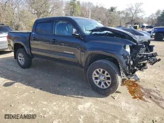 2019 Toyota Tacoma 4WD SR with VIN 3TMCZ5AN7KM213103, listed as a Copart auction lot 52088505 with 79,926 mi miles and Salvage Title. Bid and sale history available at carsss.com. Image 4.