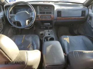 1998 Jeep Grand Cherokee with VIN 1J4FX48S4WC345469, listed as a Copart auction lot 80721224 with 201,543 mi miles and Salvage title. Bid and sale history available at DreamBid. Image 8.