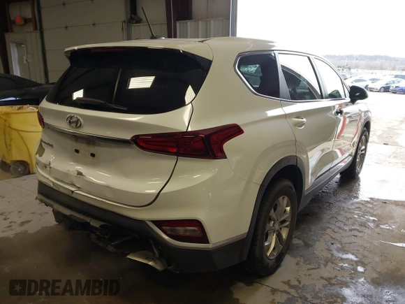2019 Hyundai Santa Fe SE with VIN 5NMS23AD1KH063472, listed as a IAAI auction lot 41375650 with 64,496 mi miles and . Bid and sale history available at DreamBid. Image 4.