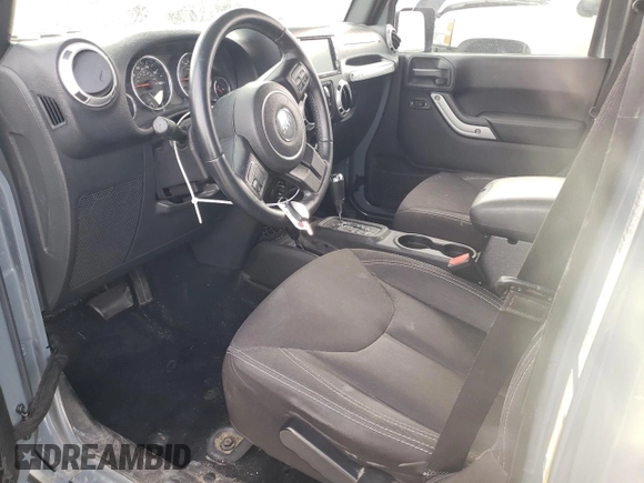 2015 Jeep Wrangler Unlimited Sahara with VIN 1C4BJWEG6FL640316, listed as a Copart auction lot 48024865 with 128,317 mi miles and Salvage Title. Bid and sale history available at carsss.com. Image 7.
