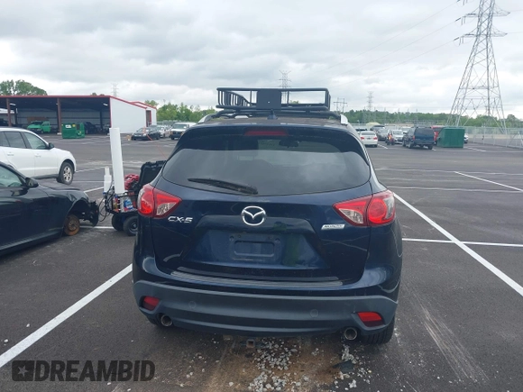 2016 Mazda CX-5 Grand Touring with VIN JM3KE2DYXG0890174, listed as a IAAI auction lot 42157884 with 141,873 mi miles. Bid and sale history available at carsss.com. Image 16.