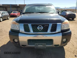 2014 Nissan Titan Pro-4X with VIN 1N6AA0EC2EN519983, listed as a Copart auction lot 71496934 with 150,259 mi miles and Salvage title. Bid and sale history available at DreamBid. Image 5.