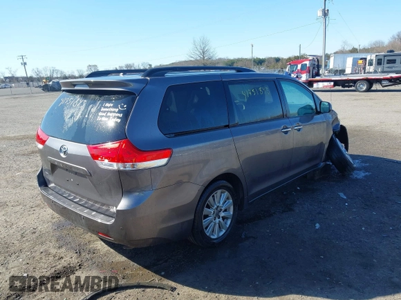 2014 Toyota Sienna Ltd with VIN 5TDDK3DC4ES083230, listed as a IAAI auction lot 41751843 with 184,501 mi miles. Bid and sale history available at carsss.com. Image 4.