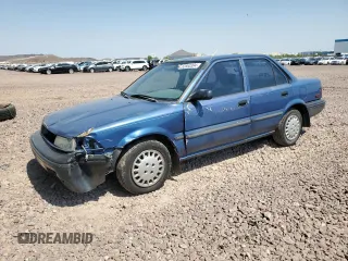1990 Toyota Corolla z VIN 1NXAE94A2LZ145465, wystawiony jako Copart lot #62863394 z przebiegiem 126 086 mil mil oraz Szkoda całkowita • Salvage title. Historia ofert i sprzedaży dostępna na DreamBid. Obrazek 1.
