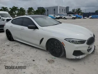 2020 BMW 8 Series M850i with VIN WBAGV8C00LCD38284, listed as a Copart auction lot 60605075 with 57,161 mi miles and Salvage title. Bid and sale history available at DreamBid. Image 4.