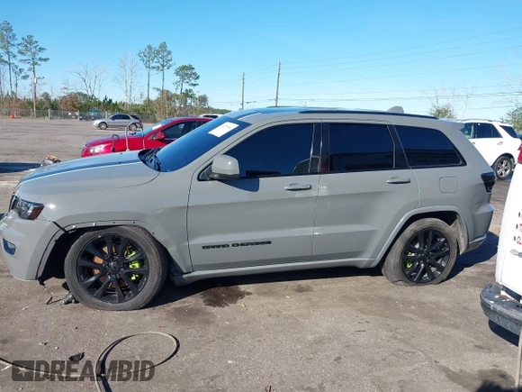 2021 Jeep Grand Cherokee Laredo E with VIN 1C4RJEAG3MC713511, listed as a IAAI auction lot 41235904 with 73,343 mi miles and . Bid and sale history available at DreamBid. Image 14.