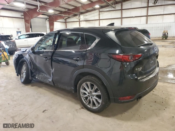 2021 Mazda CX-5 Grand Touring Reserve with VIN JM3KFBAY7M0308125, listed as a Copart auction lot 49658085 with 76,470 mi miles and Clean Title. Bid and sale history available at carsss.com. Image 2.