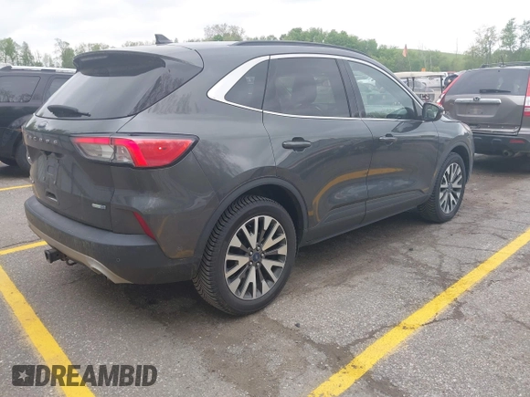 2020 Ford Escape Titanium with VIN 1FMCU9J96LUA00564, listed as a IAAI auction lot 42261152 with 73,748 mi miles and . Bid and sale history available at DreamBid. Image 4.