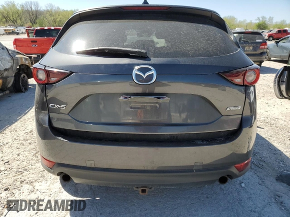 2017 Mazda CX-5 Touring with VIN JM3KFACL1H0100436, listed as a Copart auction lot 53058875 with 77,205 mi miles and Salvage Title. Bid and sale history available at DreamBid. Image 6.