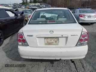 2000 Mazda Protege DX with VIN JM1BJ2221Y0208156, listed as a IAAI auction lot 41609657 with 435,304 mi miles and . Bid and sale history available at DreamBid. Image 15.