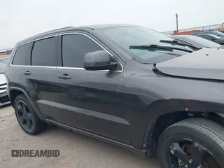 2015 Jeep Grand Cherokee Altitude with VIN 1C4RJEAG3FC219782, listed as a IAAI auction lot 42076212 with 194,910 mi miles. Bid and sale history available at carsss.com. Image 13.