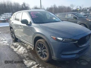 2021 Mazda CX-5 Touring with VIN JM3KFBCMXM0463469, listed as a IAAI auction lot 41488993 with 28,582 mi miles. Bid and sale history available at carsss.com. Image 1.