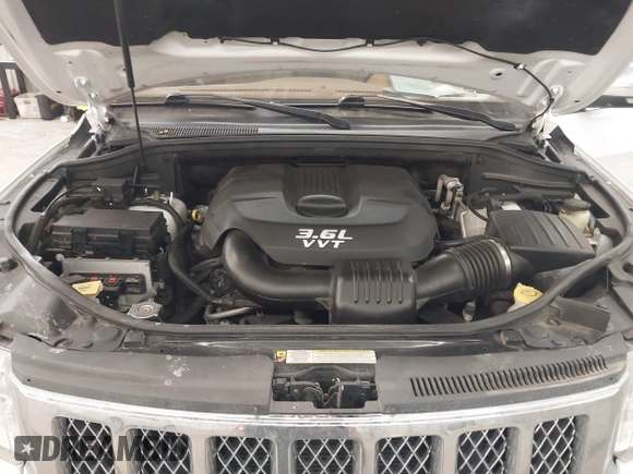 2013 Jeep Grand Cherokee Overland with VIN 1C4RJFCG7DC581808, listed as a IAAI auction lot 41242922 with 187,442 mi miles. Bid and sale history available at carsss.com. Image 10.
