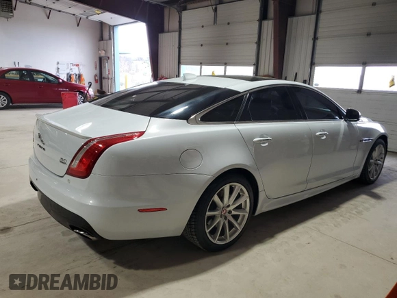 2016 Jaguar XJ R-Sport with VIN SAJWJ1CDXG8W00145, listed as a Copart auction lot 49901234 with 76,629 mi miles and . Bid and sale history available at DreamBid. Image 3.