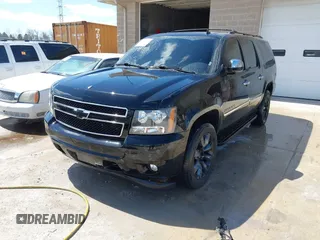 2010 Chevrolet Suburban LTZ with VIN 1GNUKKE39AR106851, listed as a IAAI auction lot 41994155 with 148,776 mi miles. Bid and sale history available at carsss.com. Image 2.