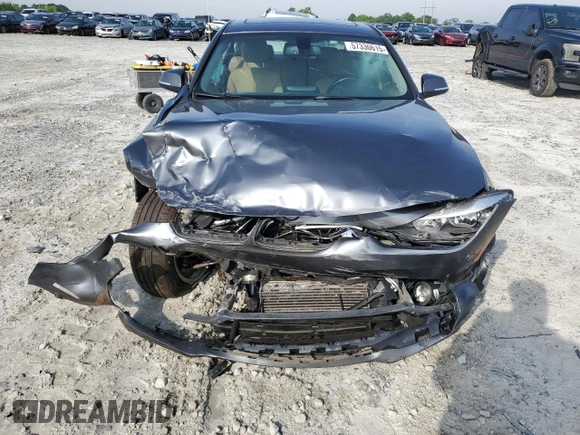 2014 BMW 3 Series 328i with VIN WBA3A5G50ENP33259, listed as a Copart auction lot 57330615 with 217,779 mi miles and Salvage title. Bid and sale history available at DreamBid. Image 5.