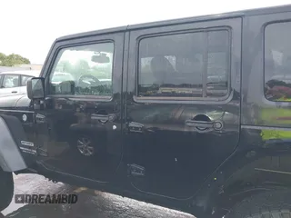 2015 Jeep Wrangler Unlimited Willys Wheeler with VIN 1C4BJWDG4FL687829, listed as a IAAI auction lot 42099147 with 98,969 mi miles and . Bid and sale history available at DreamBid. Image 15.