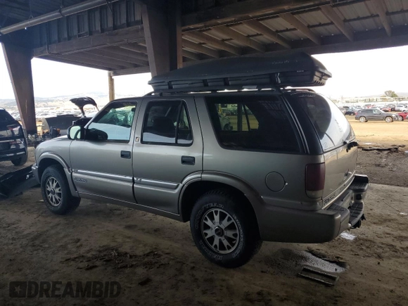 2000 GMC Jimmy SLE Convenience z VIN 1GKDT13W7Y2384460, wystawiony jako Copart lot #85545254 z przebiegiem 165 787 mil mil oraz Czysty tytuł • Clean title. Historia ofert i sprzedaży dostępna na DreamBid. Obrazek 2.
